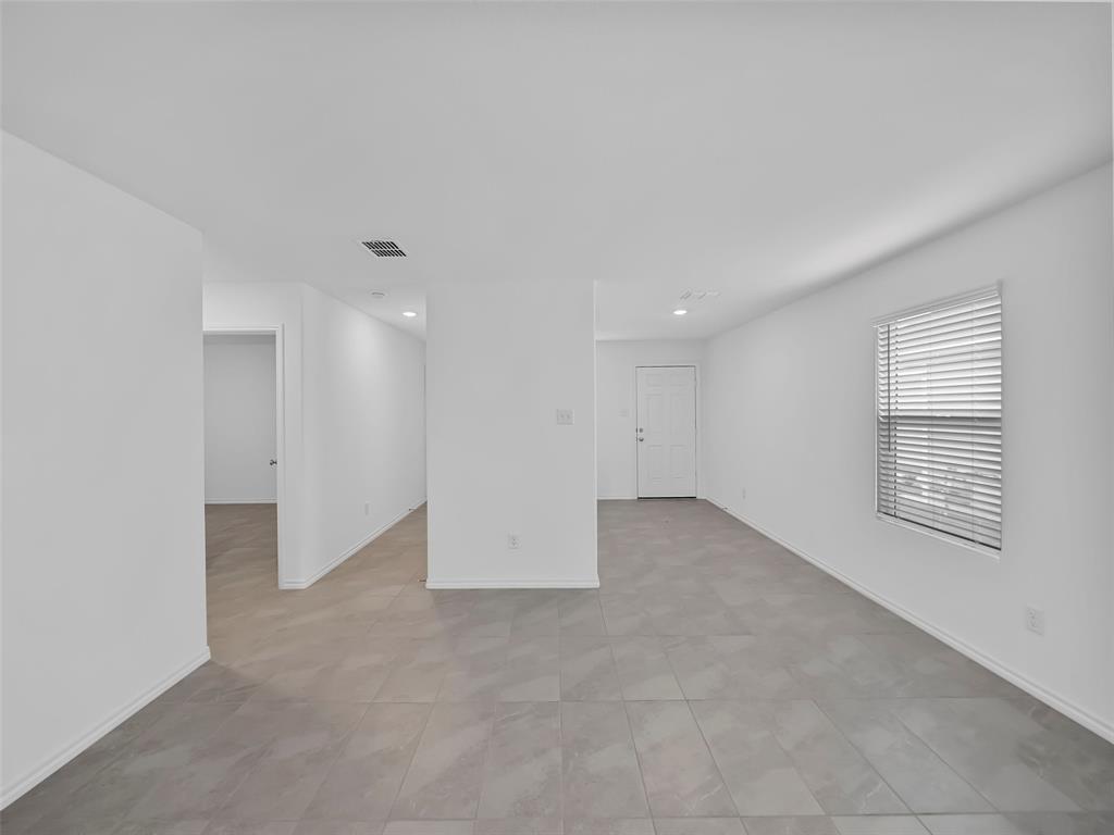 7765 Ruellia Road McKinney, TX 75071 - Photo 13 of 40 a view of an empty room with a window