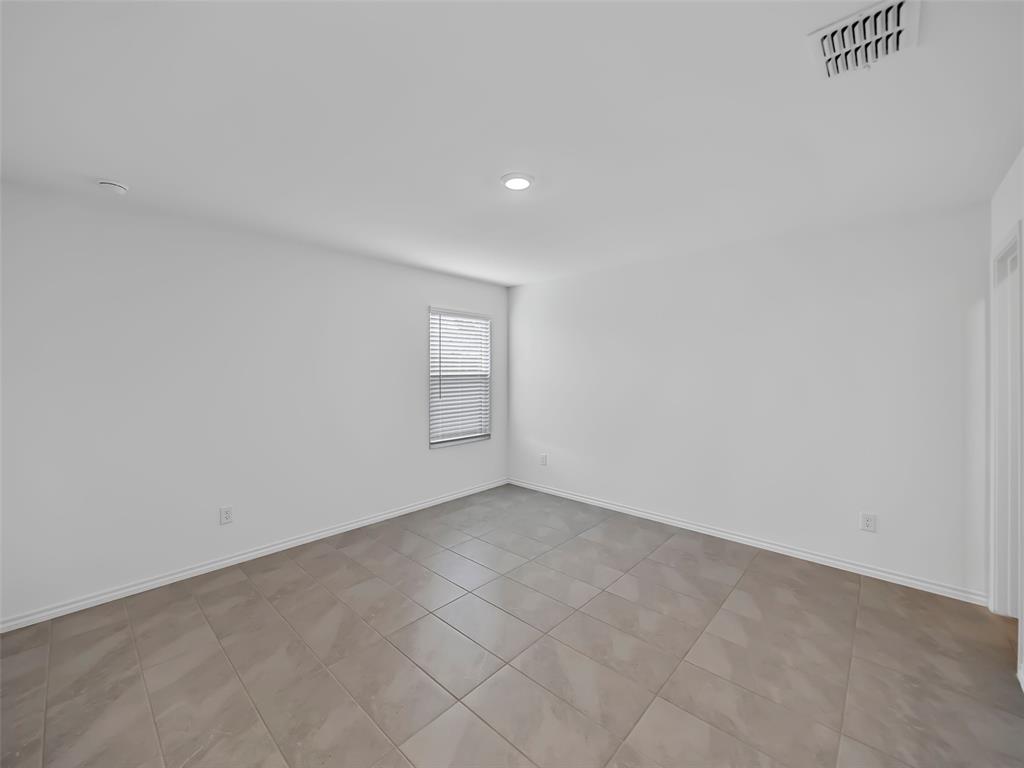 7765 Ruellia Road McKinney, TX 75071 - Photo 21 of 40 a view of an empty room and window