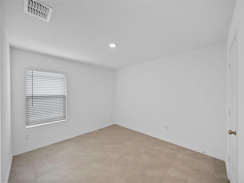 7765 Ruellia Road McKinney, TX 75071 - Photo 25 of 40 a view of an empty room with a window