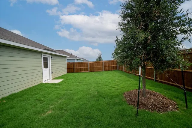 a view of a backyard with a garden