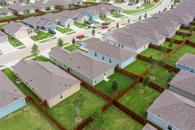 an aerial view of a house with a garden