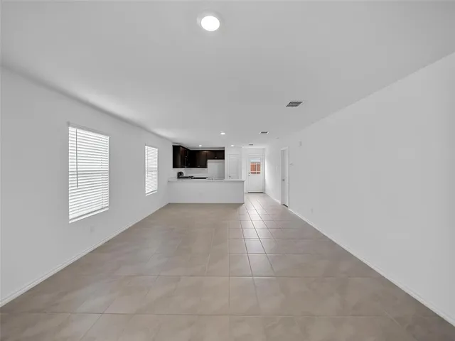 a view of open kitchen with a sink and dishwasher cabinets