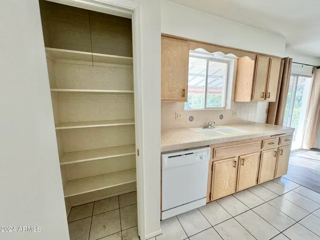 a view of a sink and window in a room