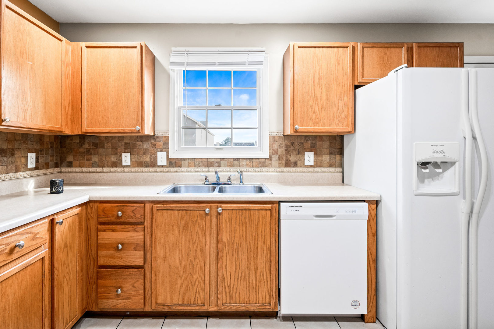 1109 East Shelbourne Drive Normal, IL 61761 - Photo 12 of 33 a kitchen with stainless steel appliances granite countertop a refrigerator and a sink
