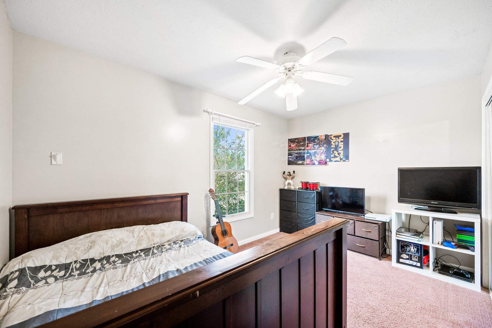 1109 East Shelbourne Drive Normal, IL 61761 - Photo 20 of 33 a bedroom with a bed and a flat screen tv