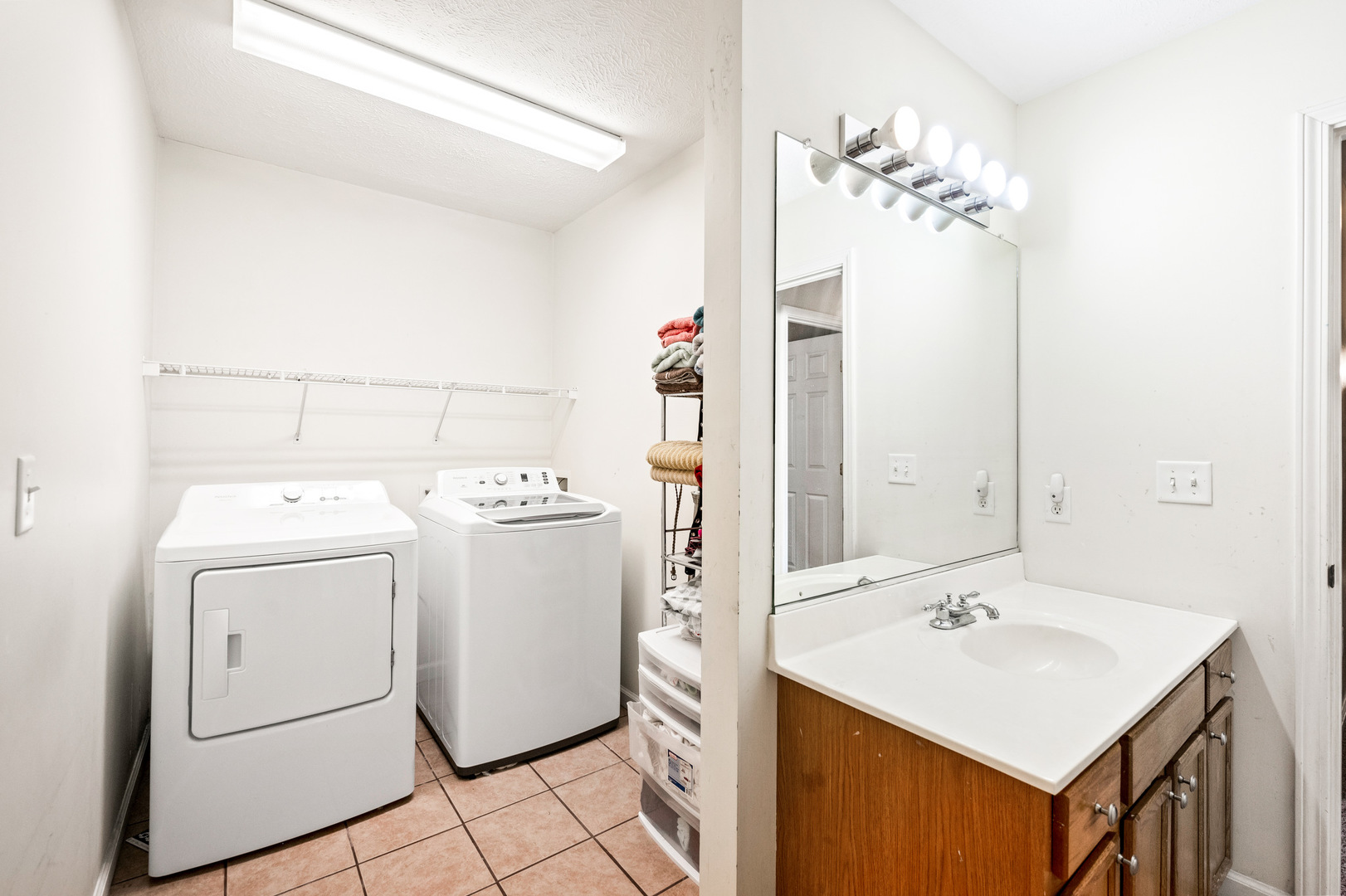 1109 East Shelbourne Drive Normal, IL 61761 - Photo 22 of 33 a bathroom with a sink vanity and a mirror
