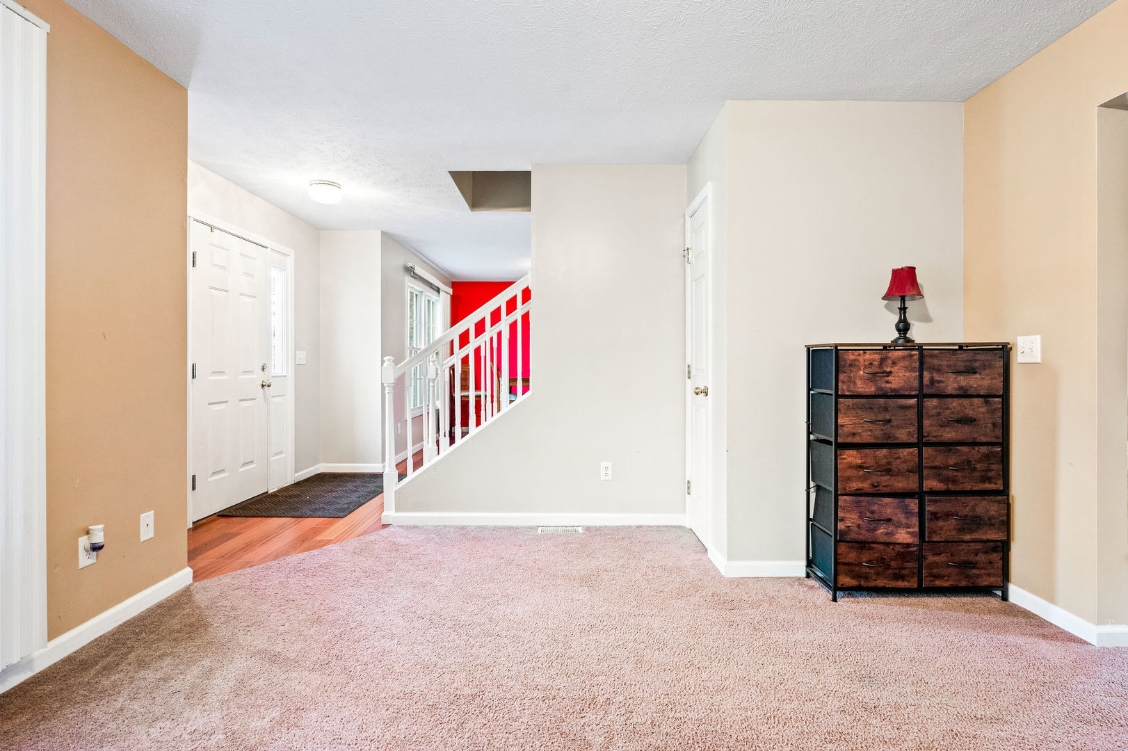 1109 East Shelbourne Drive Normal, IL 61761 - Photo 3 of 33 an empty room with bookshelf and entryway