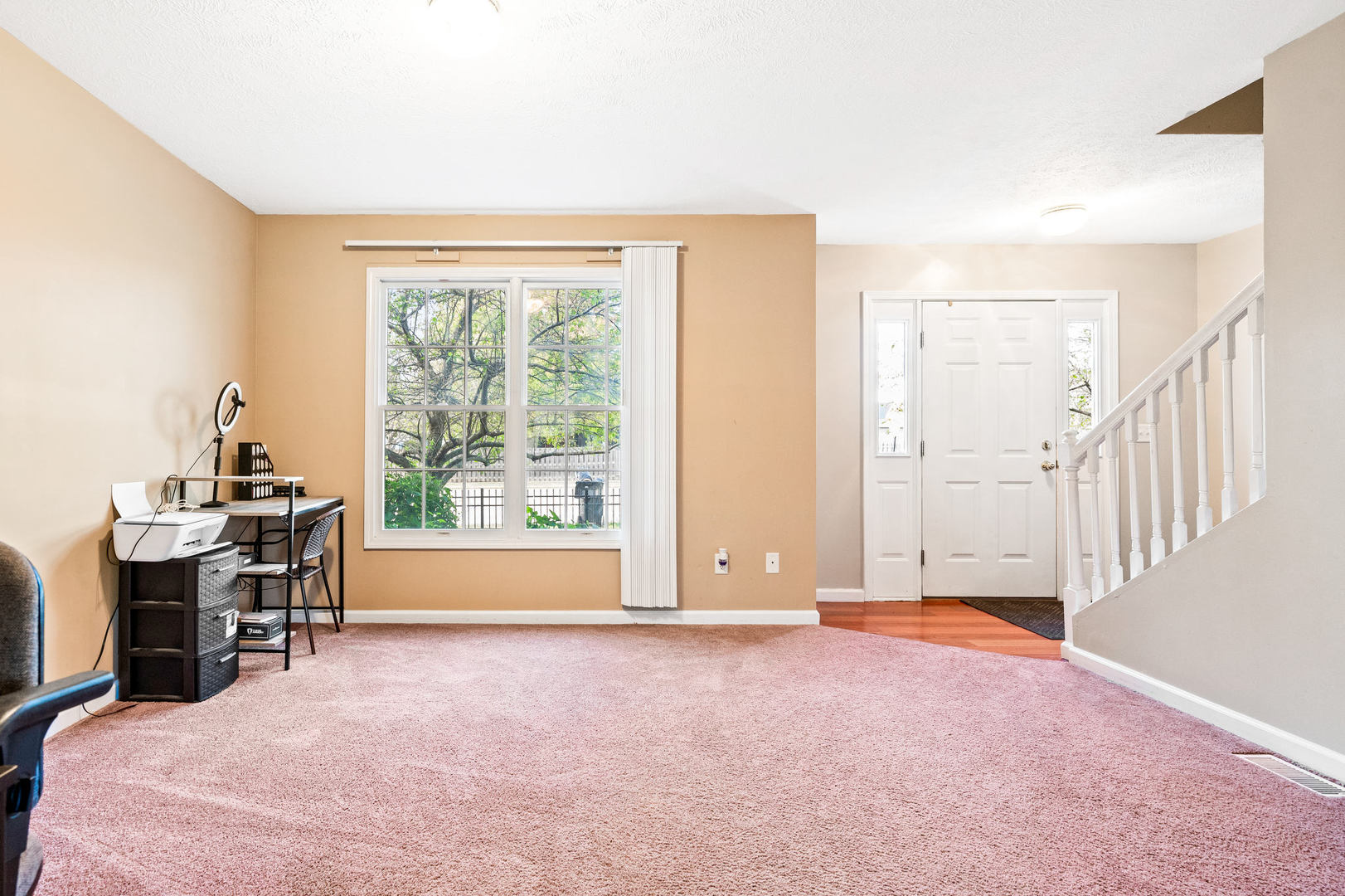 1109 East Shelbourne Drive Normal, IL 61761 - Photo 6 of 33 a view of livingroom with workspace and a window