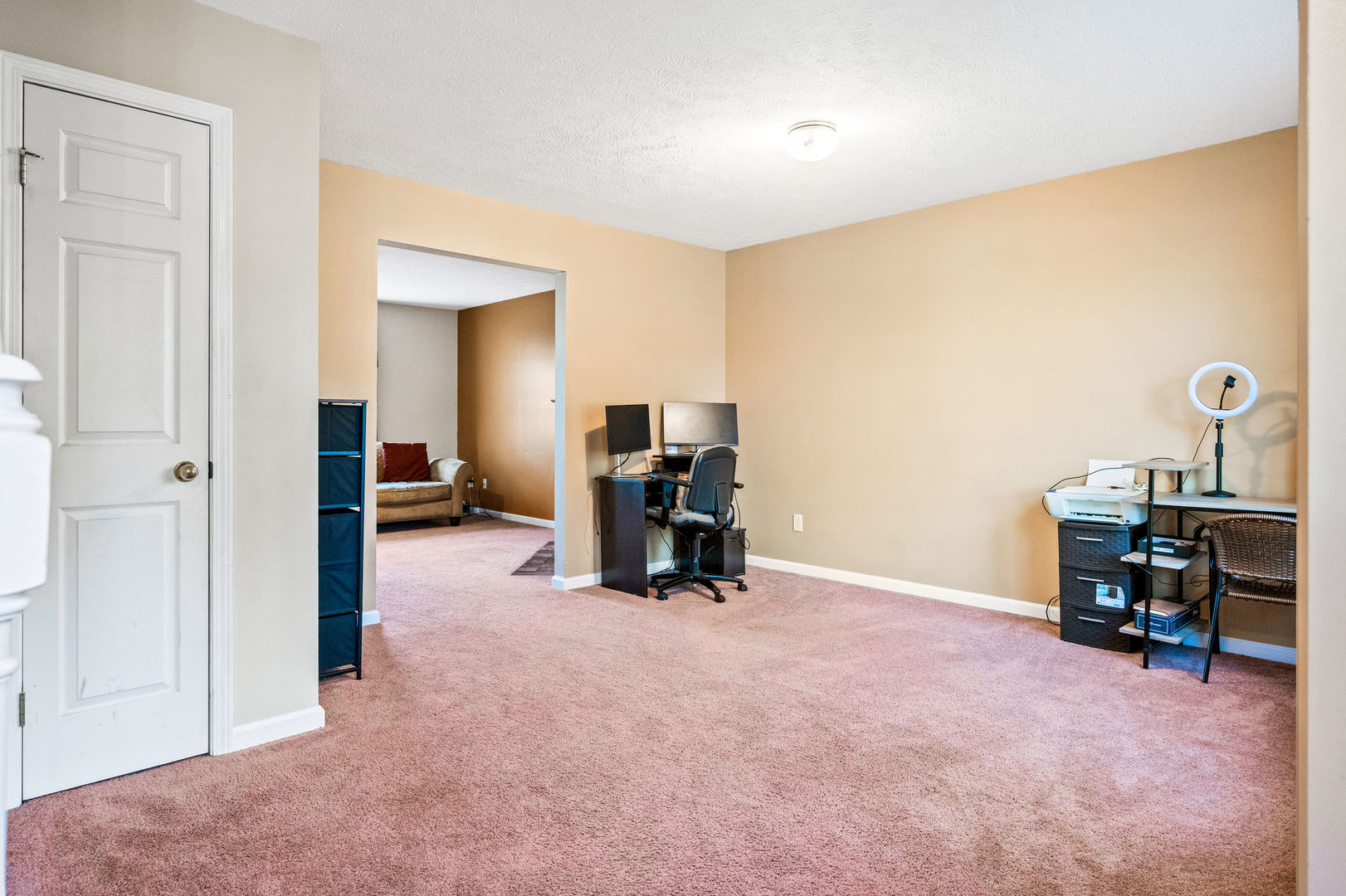 1109 East Shelbourne Drive Normal, IL 61761 - Photo 7 of 33 a view of a room with furniture and a flat screen tv