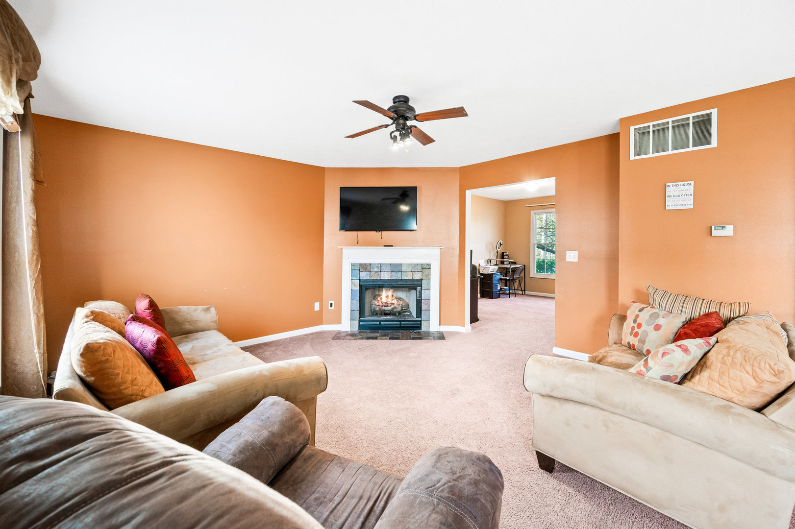1109 East Shelbourne Drive Normal, IL 61761 - Photo 8 of 33 a living room with furniture fireplace and a flat screen tv