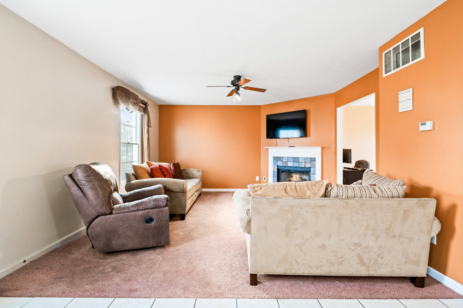 1109 East Shelbourne Drive Normal, IL 61761 - Photo 9 of 33 a living room with furniture and a fireplace