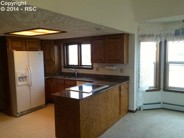 9815 Raygor Road Colorado Springs, CO 80908 - Photo 5 of 17 Kitchen with New granite