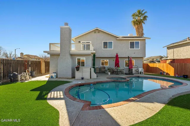 a view of a house with swimming pool