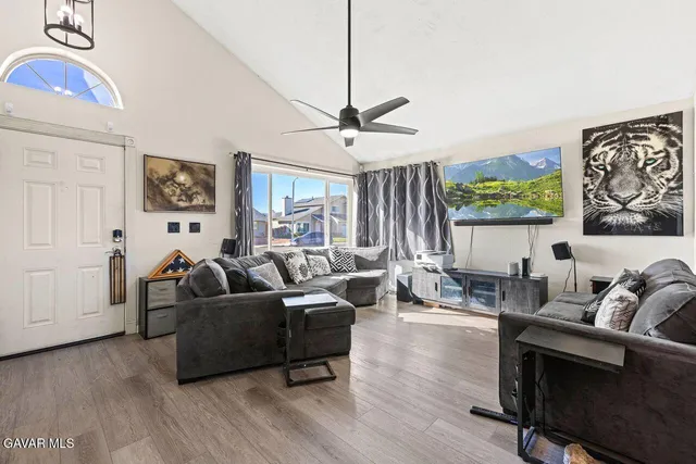 a living room with furniture and a large window