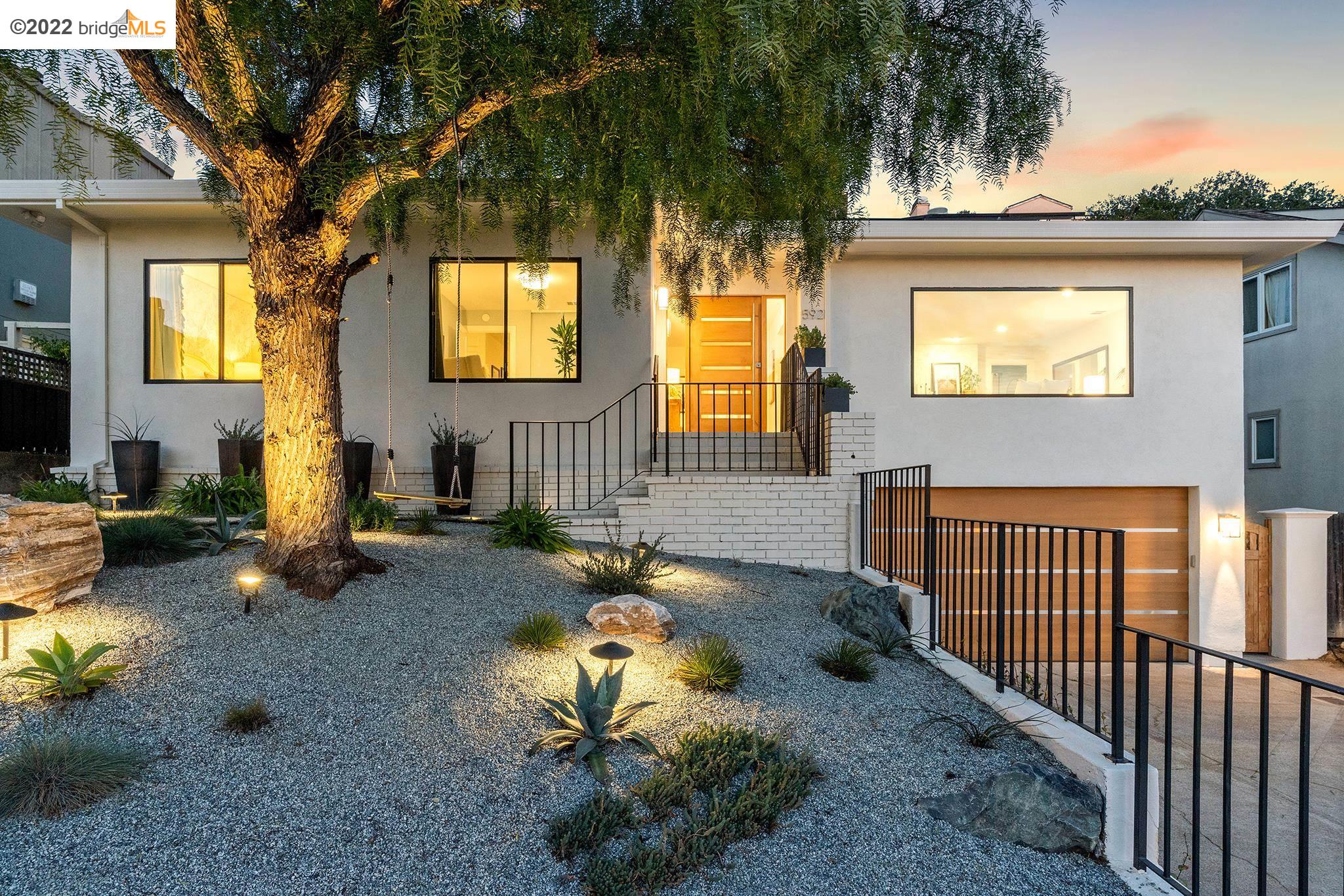 592 Mountain Boulevard Oakland, CA 94611 - Photo 1 of 1 a backyard of a house with yard fire pit and outdoor seating