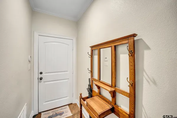 a view of entryway with wooden floor