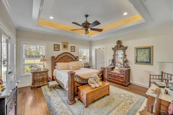 a bedroom with furniture and a rug