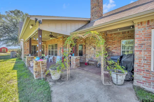 a view of a chairs and table in the patio