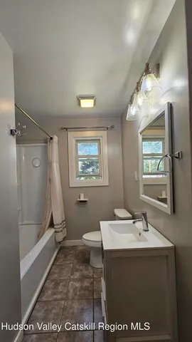 a kitchen with stainless steel appliances granite countertop a refrigerator a sink dishwasher a stove and a refrigerator