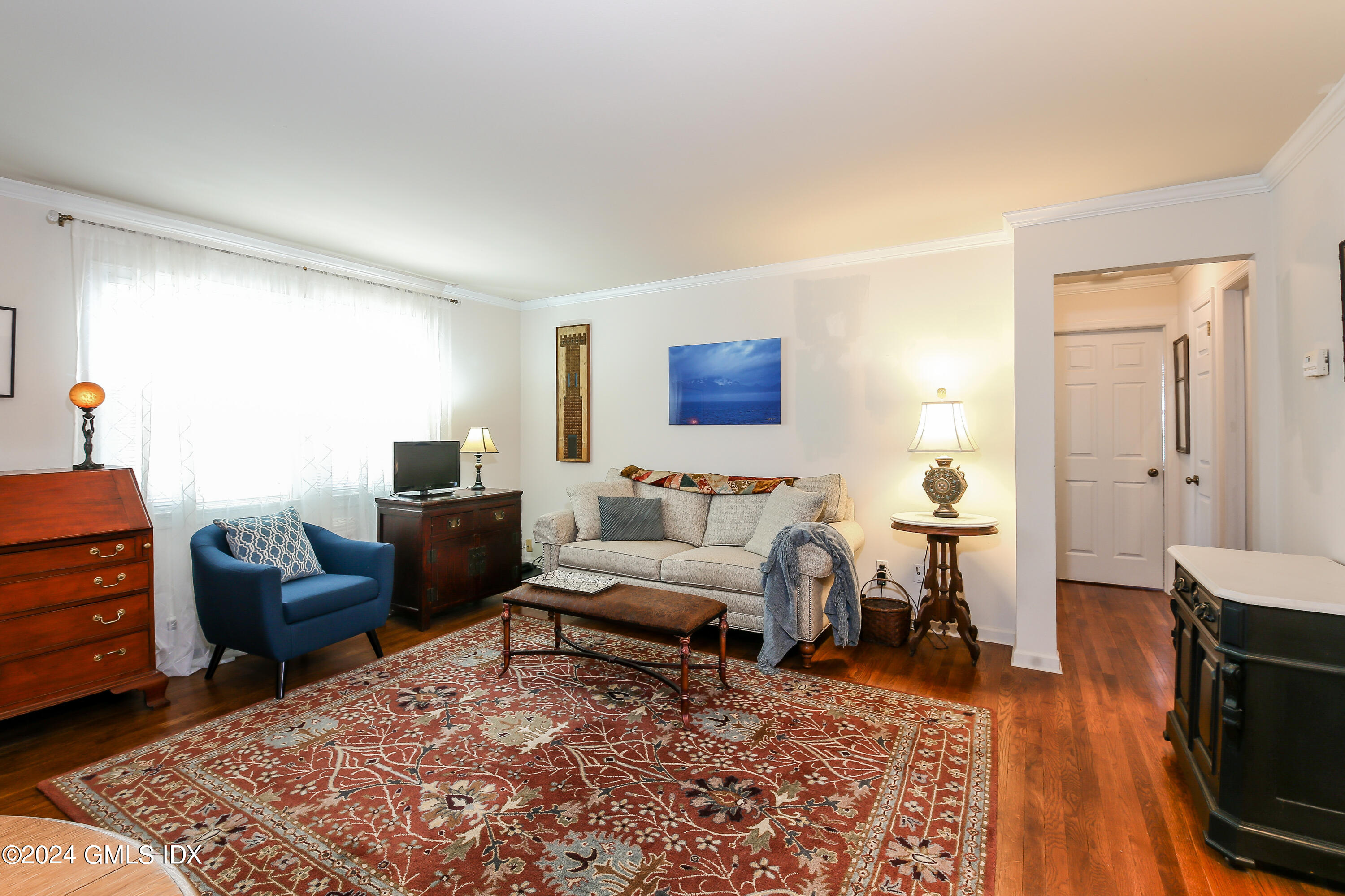 49 Valley Road, Unit D1 Cos Cob, CT 06807 - Photo 3 of 11 a living room with furniture and a flat screen tv