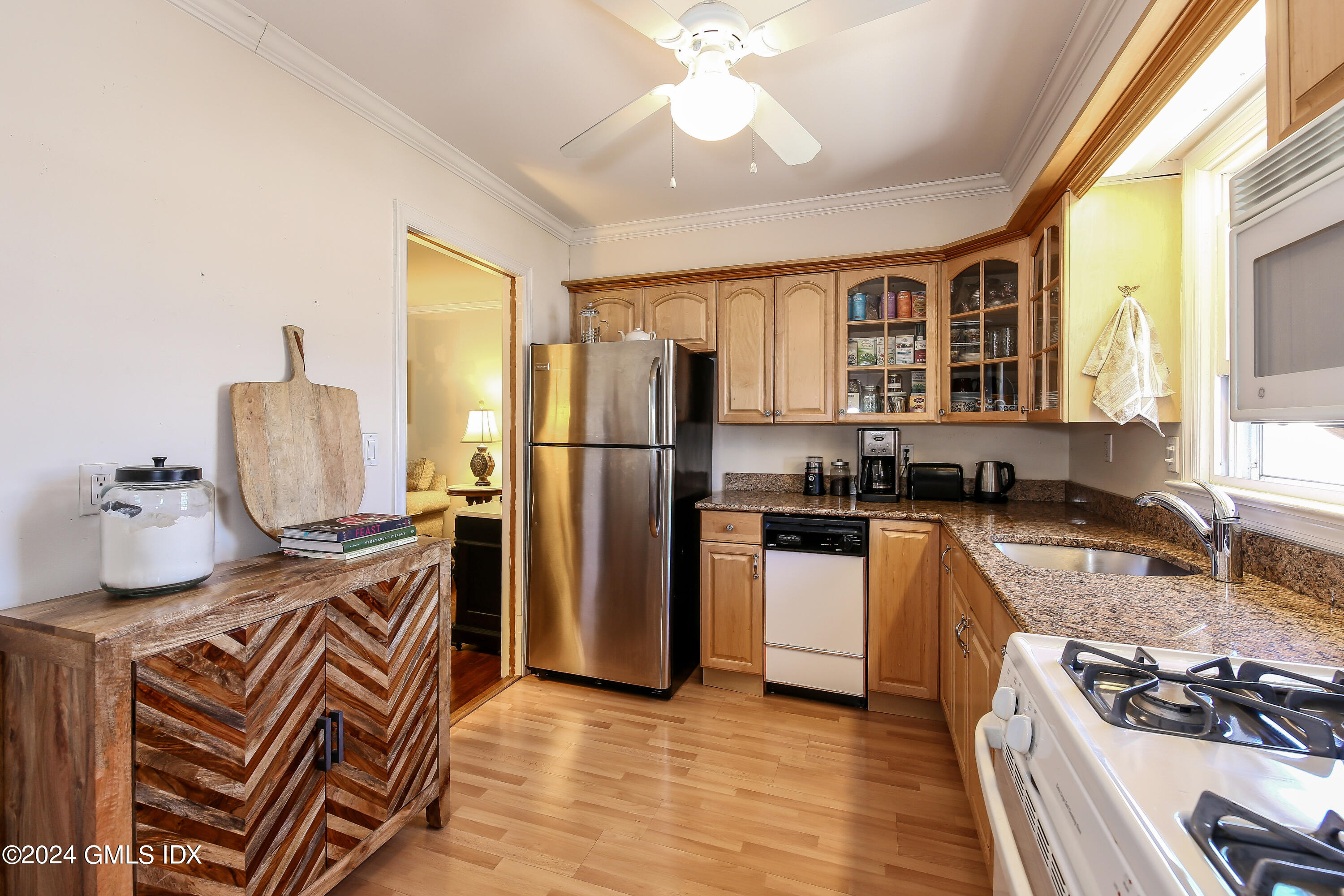 49 Valley Road, Unit D1 Cos Cob, CT 06807 - Photo 5 of 11 a kitchen with stainless steel appliances granite countertop a stove refrigerator and a sink