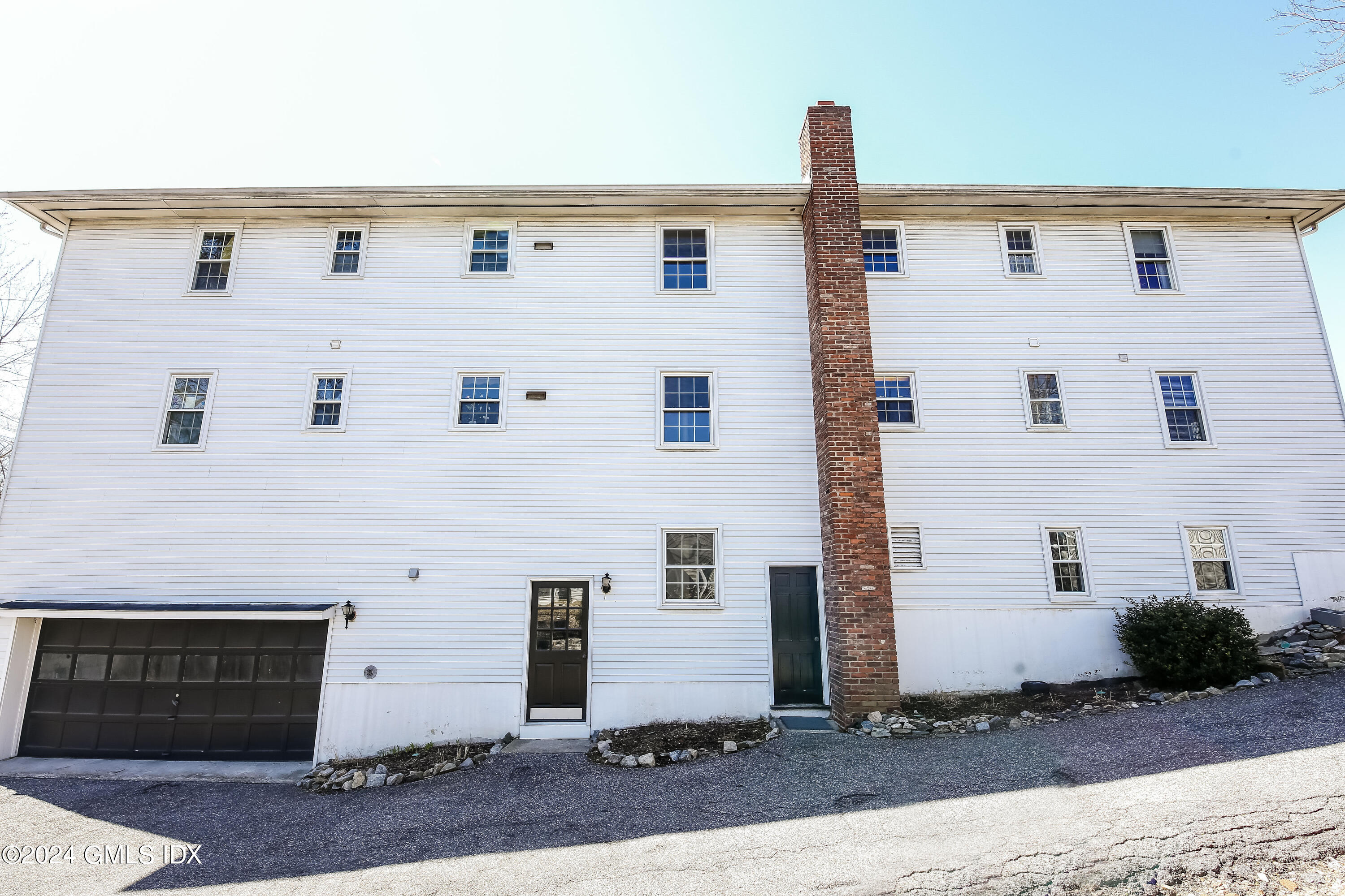 49 Valley Road, Unit D1 Cos Cob, CT 06807 - Photo 10 of 11 a front view of a building with street