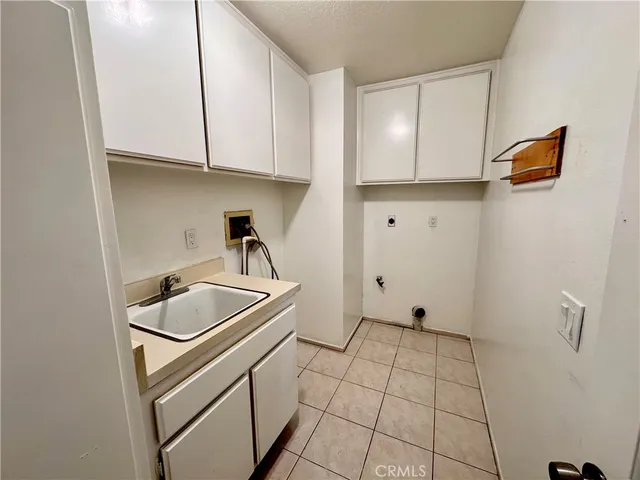 a kitchen with stainless steel appliances granite countertop a sink and a stove