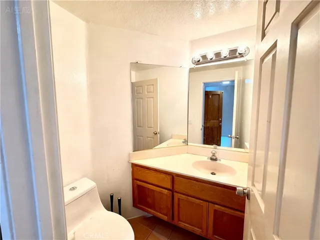 a bathroom with a sink and a large mirror