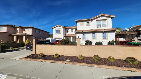 a front view of a house with street