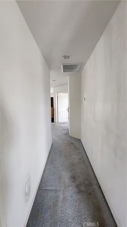 a view of hallway with windows