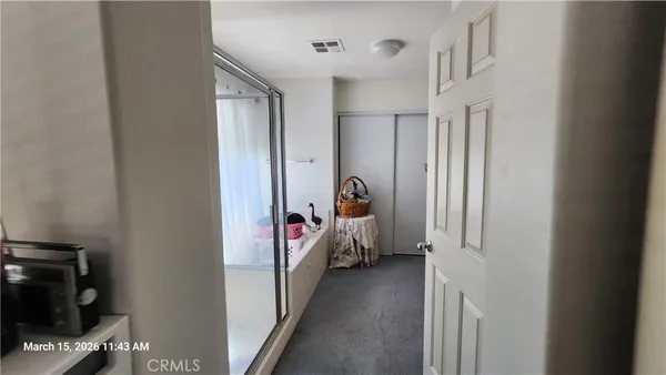 a view of a bedroom with bed and furniture