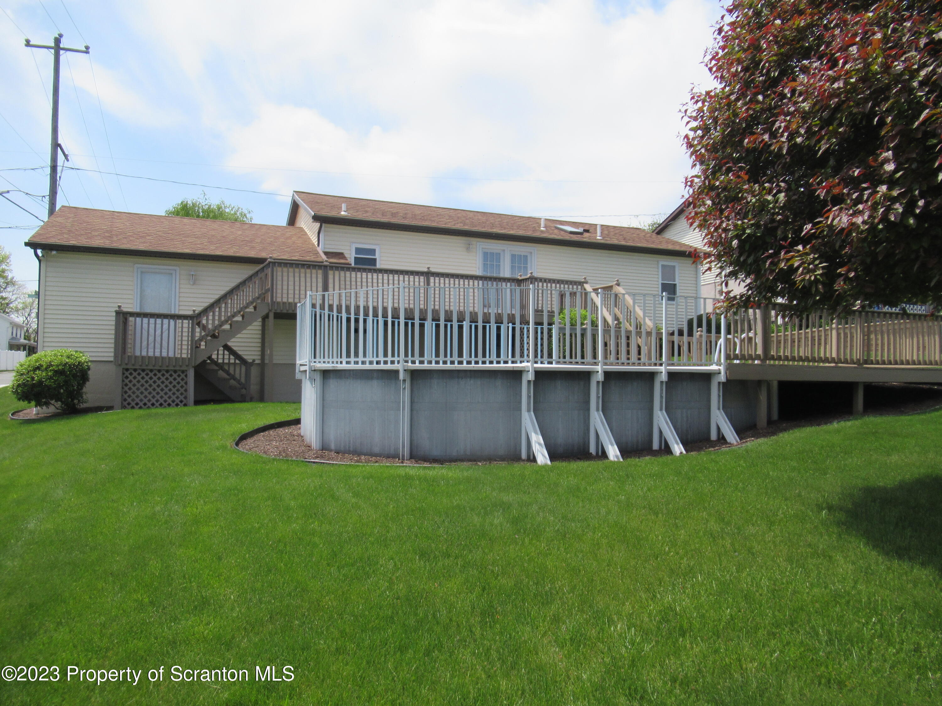 602 Eynon Street Scranton, PA 18504 - Photo 11 of 80 a view of a house with a yard and sitting area
