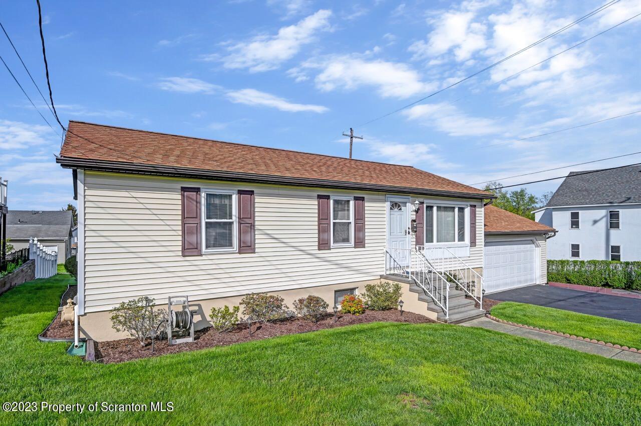 602 Eynon Street Scranton, PA 18504 - Photo 12 of 80 a front view of a house with a garden
