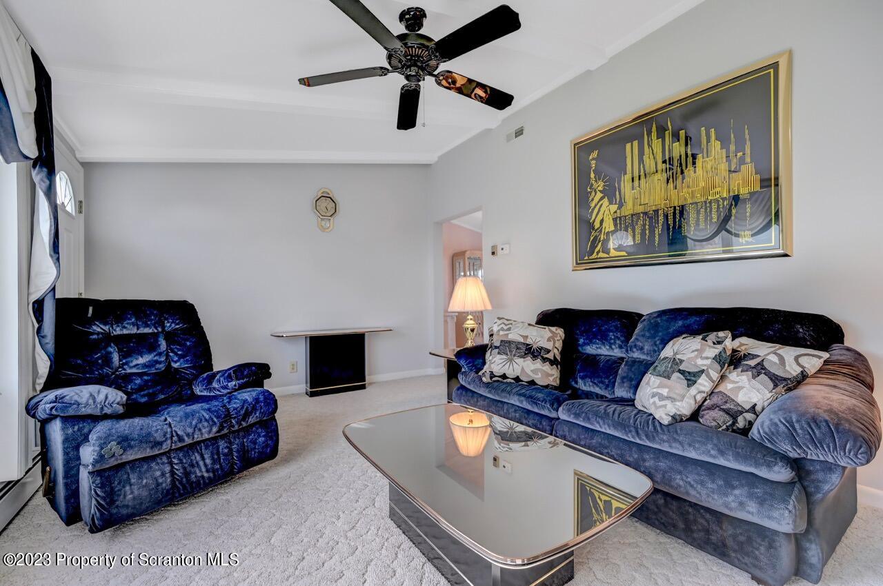 602 Eynon Street Scranton, PA 18504 - Photo 16 of 80 a living room with furniture and a fireplace