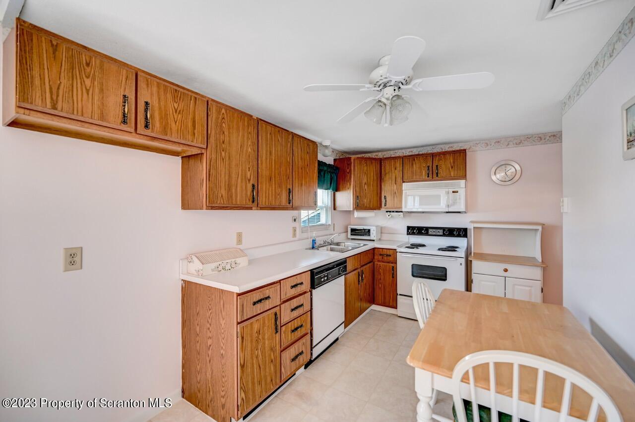 602 Eynon Street Scranton, PA 18504 - Photo 21 of 80 a kitchen with a cabinets and window
