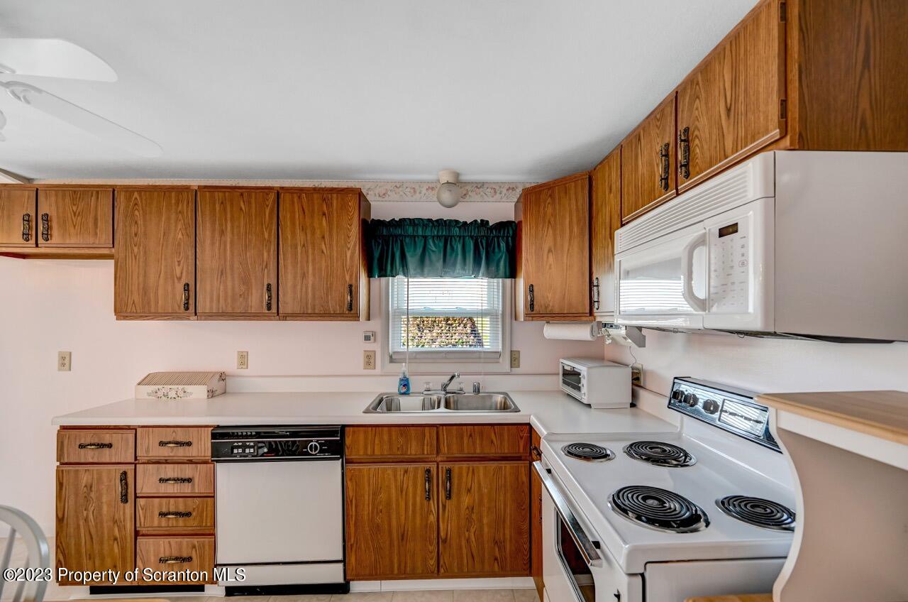 602 Eynon Street Scranton, PA 18504 - Photo 25 of 80 a kitchen with a sink stove top oven and cabinets