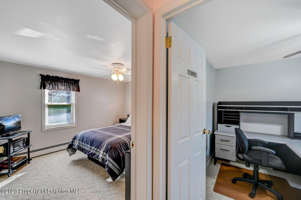 602 Eynon Street Scranton, PA 18504 - Photo 26 of 80 a bedroom with a bed and a window