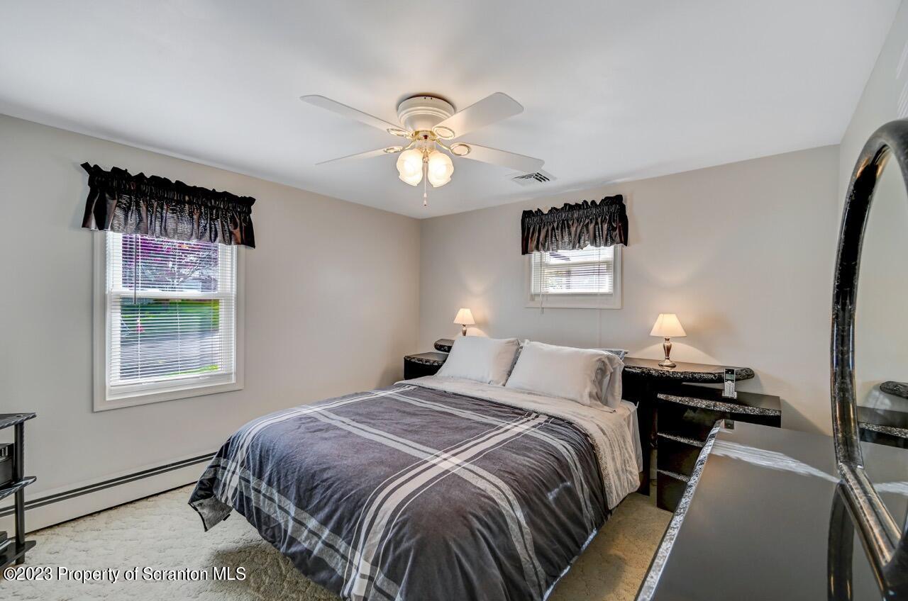 602 Eynon Street Scranton, PA 18504 - Photo 27 of 80 a bedroom with a bed and a window