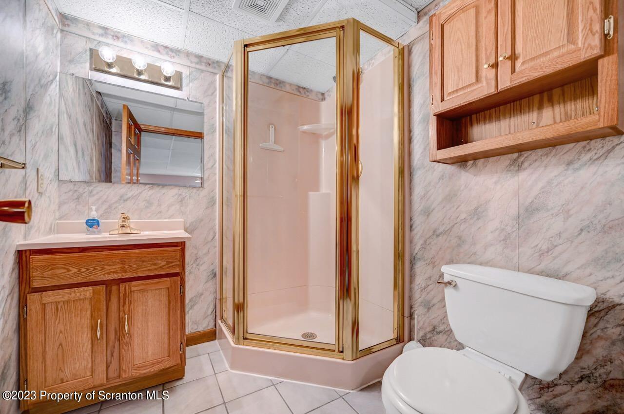 602 Eynon Street Scranton, PA 18504 - Photo 43 of 80 a bathroom with a toilet a sink and a mirror