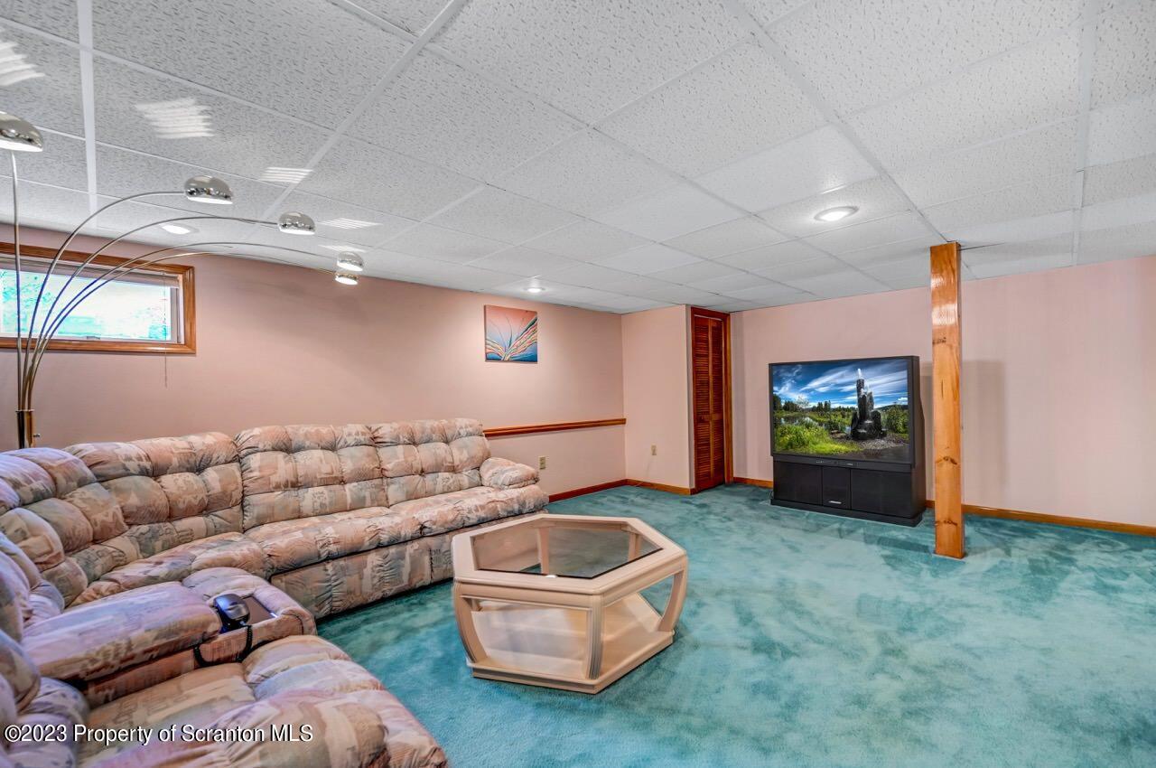 602 Eynon Street Scranton, PA 18504 - Photo 45 of 80 a living room with furniture and a flat screen tv