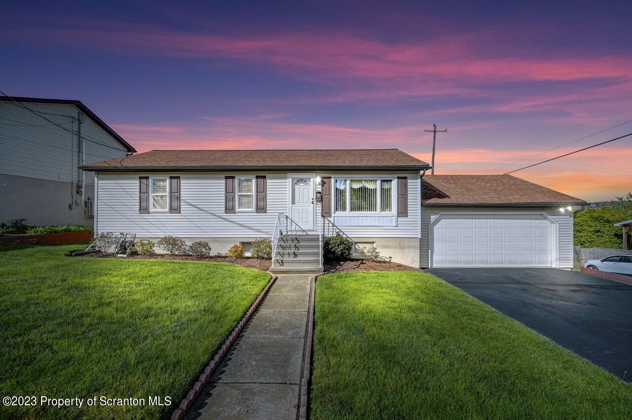 602 Eynon Street Scranton, PA 18504 - Photo 5 of 80 a front view of a house with a garden and yard