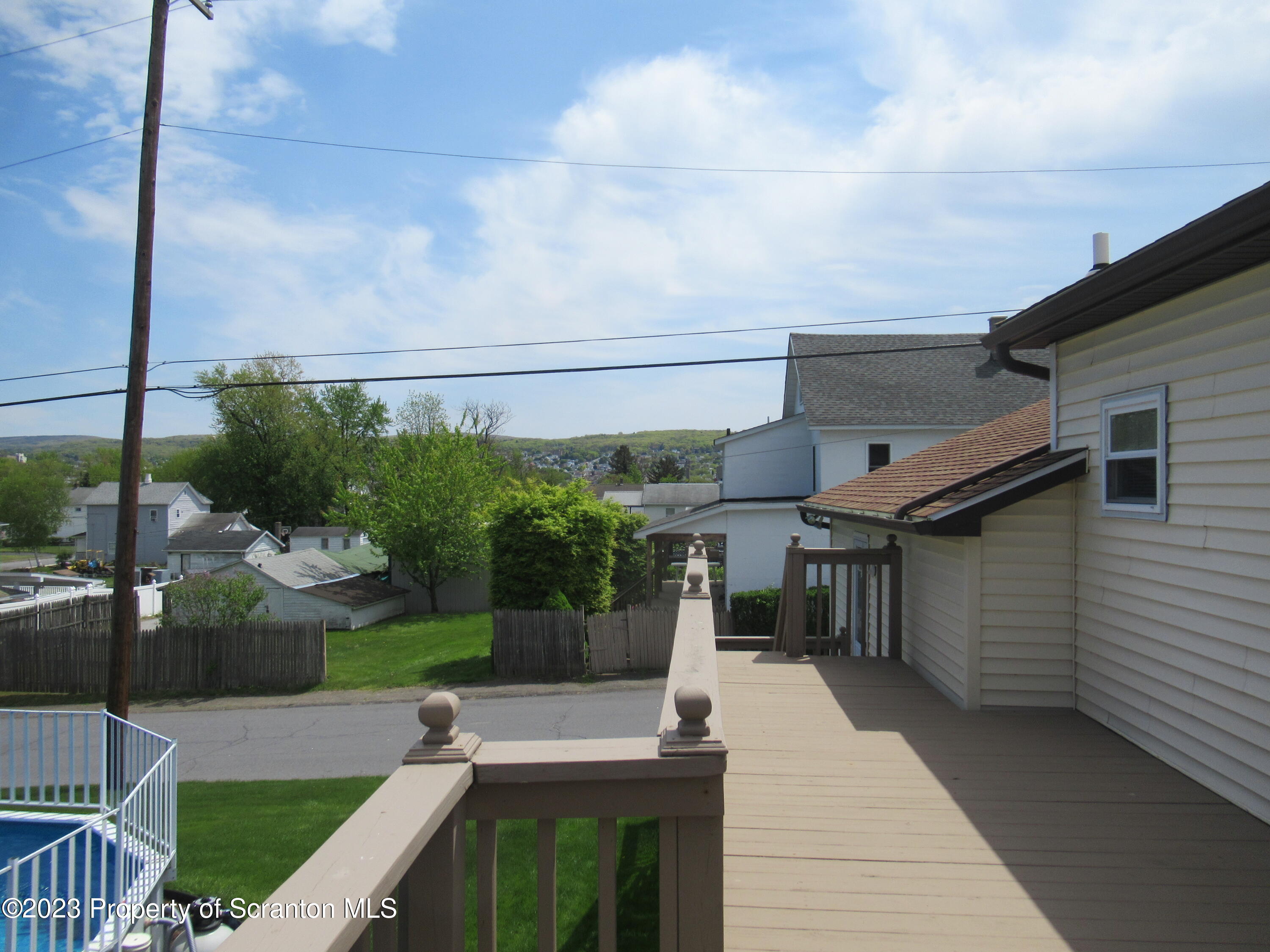 602 Eynon Street Scranton, PA 18504 - Photo 74 of 80 a view of a patio with couches potted plants and a floor to ceiling window