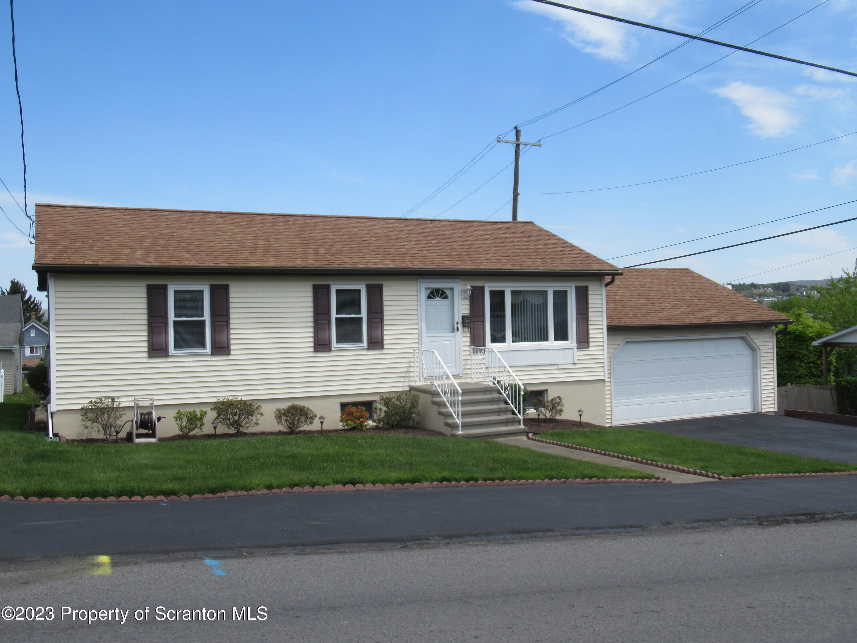 602 Eynon Street Scranton, PA 18504 - Photo 80 of 80 a front view of a house with a garden and plants