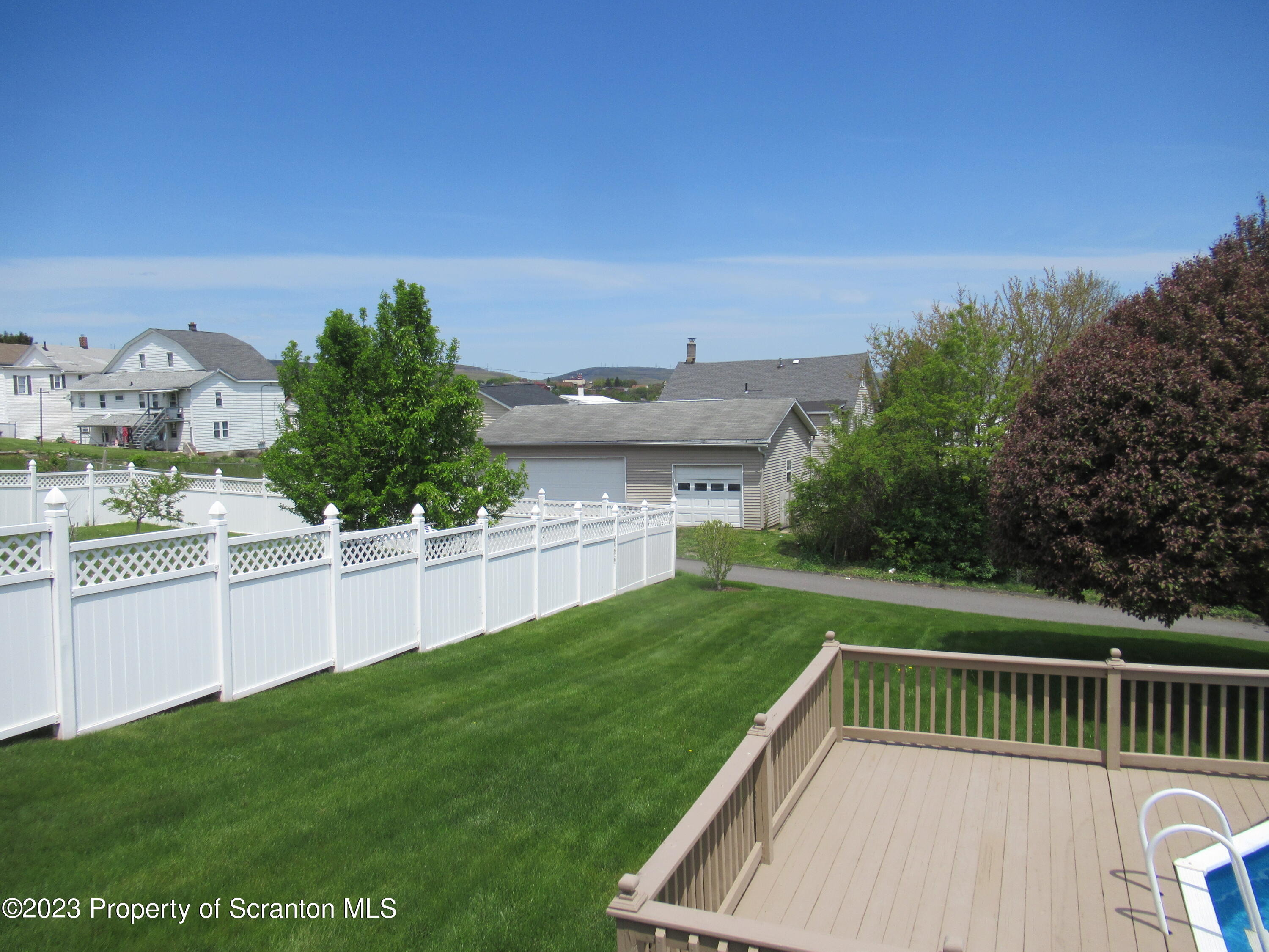 602 Eynon Street Scranton, PA 18504 - Photo 8 of 80 a view of a backyard with couches plants and large tree