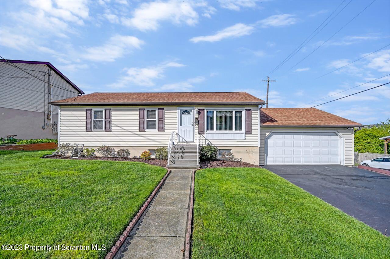 602 Eynon Street Scranton, PA 18504 - Photo 10 of 80 a front view of a house with a yard