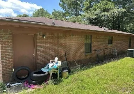 a backyard of a house with outdoor seating