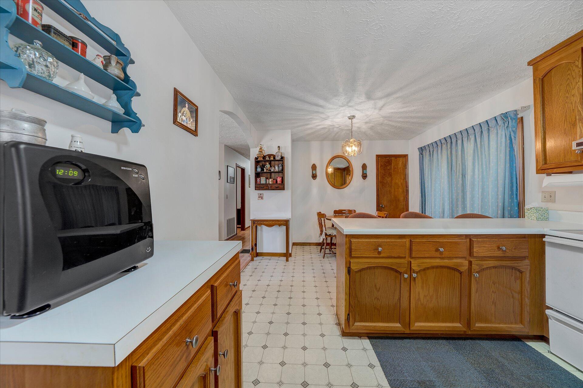 98 Sunset Ridge Road Callaway, VA 24067 - Photo 11 of 32 a kitchen with a stove and a microwave