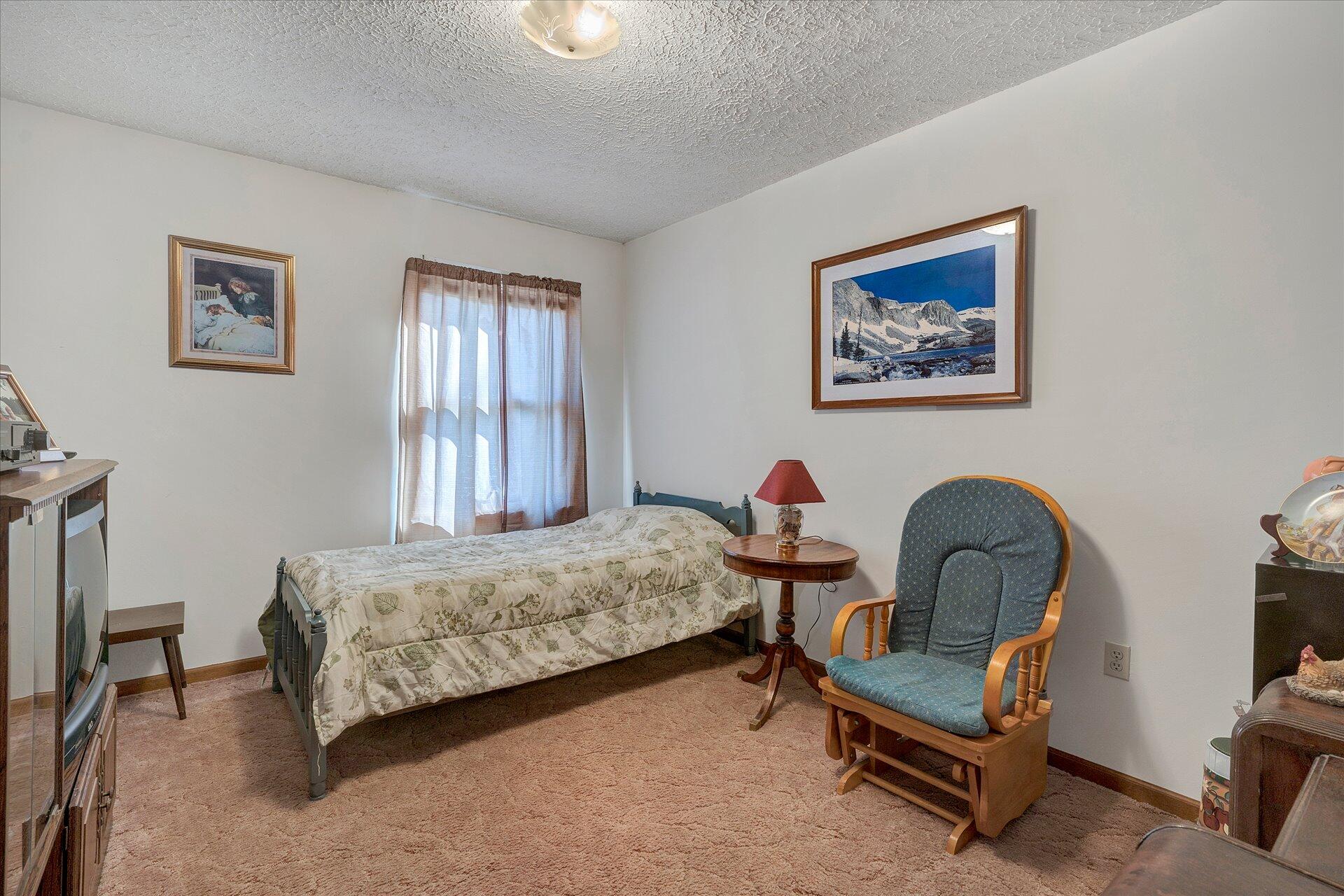 98 Sunset Ridge Road Callaway, VA 24067 - Photo 12 of 32 a bedroom with bed and a window