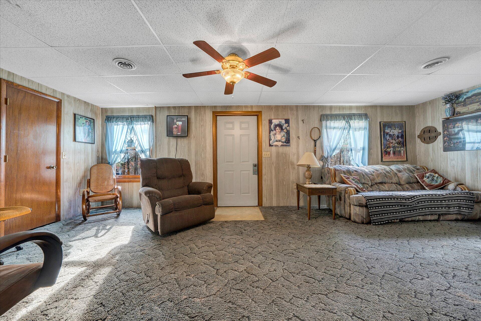 98 Sunset Ridge Road Callaway, VA 24067 - Photo 24 of 32 a living room with furniture and a large window