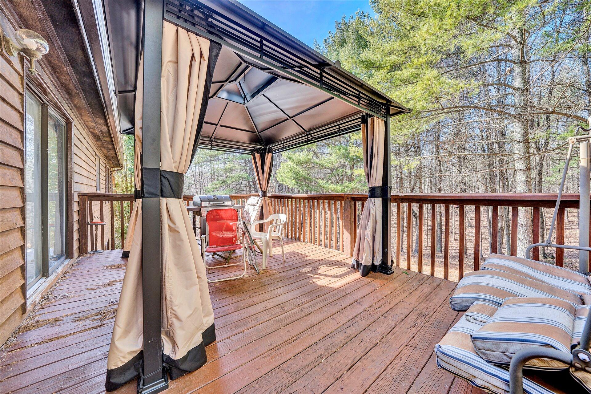 98 Sunset Ridge Road Callaway, VA 24067 - Photo 26 of 32 a view of balcony with wooden floor and outdoor seating